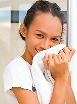 Pretty ladyboy slowly stripping off in a bathroom