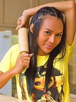 Lewd tranny using a big rolling pin in a kinky way