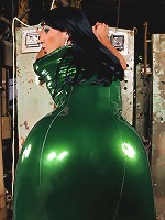 Shemale clad in metallic green latex